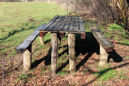Wooden Outdoor Table Made From Tree Stumps And Pallets With Two