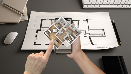 Wall Mural - augmented reality concept. hand holding smartphone with ar application used to simulate 3d pop-up in