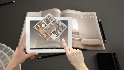 Wall Mural - augmented reality concept. hand holding tablet with ar application used to simulate 3d pop-up intera