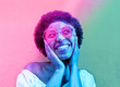 Millennial african woman smiling and wearing sunglasses - Black afro girl having fun in front of camera - Youth lifestyle concept - Radial blue and purple filter editing