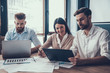 © VadimGuzhva - Businesspeople Working with Laptop in Office.