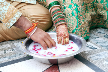 Wall Mural - Indian couple playing Ring Fishing game in wedding ceremony of India