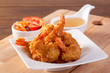 © Chaded - Fried prawn balls with sweet sauce on wooden table