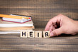 Heir concept. Wooden letters on the office desk, informative and communication background
