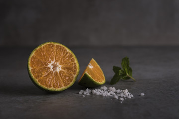 Wall Mural - Fresh orange fruits and juice on stone table.