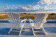 Beach chairs on Cape Cod beach at sunset, Cape Cod, Massachusetts, USA.