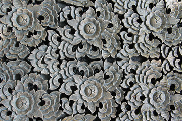 Pattern of flower carved on wood.