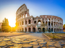 Colosseum At Sunrise, Rome. Rome Architecture And Landmark. Rome Colosseum Is One Of The Best Known Monuments Of Rome And Italy