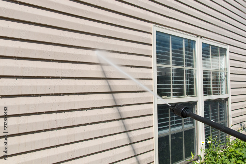 Power washing. House wall siding cleaning with high pressure water jet. - obrazy, fototapety, plakaty 