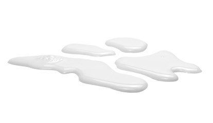 Wall Mural - Spilled milk puddle isolated on white background and texture