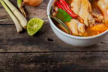 Wall Mural - Chicken tom yam  in a hot white bowl to eat.