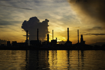 Petrochemical plant On the river During sunrise