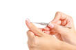 Female hands french manicure pusher on white background isolation