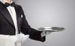 © ra2 studio - Waiter serving with white gloves and steel tray in an empty space