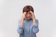 © Viktor Koldunov - Portrait of worried mature woman touching her temples feeling stress, on gray background
