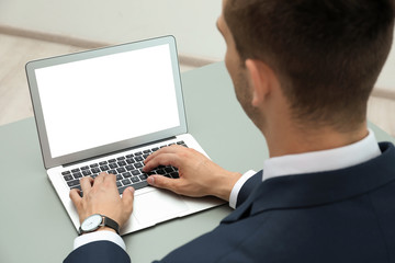 Sticker - Man in office wear using laptop at table indoors