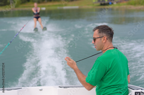 Fotografie, Obraz unidentified participant shows her skills during an open waterski competition