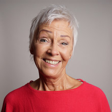 Happy Older Woman In Her 60s With Trendy Short White Hair Laughing