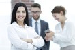 © ASDF - close-up of a beautiful woman manager and co-workers in the office