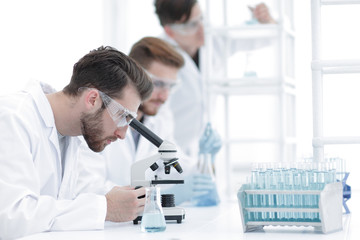 Wall Mural - background image scientists working with the microscope