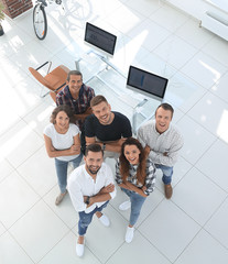 Canvas Print - young professionals standing near the desktop