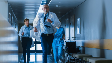 Emergency in the Hospital, Doctors and Nurses Running through the Hallway, in a Hurry to Save Lives.