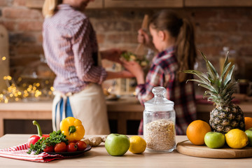 natural organic food ingredients. healthy lifestyle and balanced eating. fresh vegetables fruit and oatmeal on the table