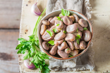 Top view of broad beans boiled with garlic and parsley