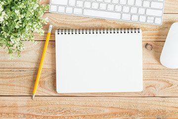 Wall Mural - blank notebook and yellow pencil on brown wood,flat lay photo of notebook for your message