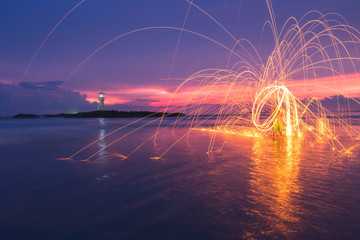Wall Mural - Fire steel wool on beach