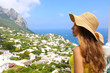 © zigres - Beautiful woman with straw hat looking at Capri sight from terrace, Capri Island, Italy