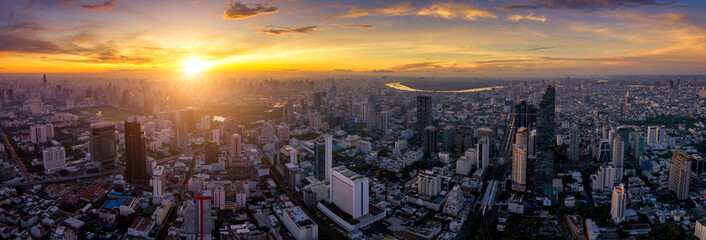 Wall Mural - aerial view of bangkok skyline panorama and skyscraper with light trails on silom road center of bus