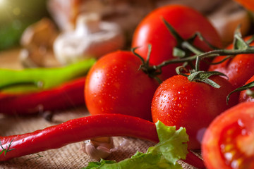 Wall Mural - red tomatoes and ripe red pepper with water drops, healthy food concept