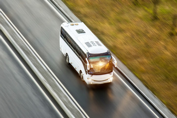 Wall Mural - Tourist bus spee ride on highway, blured in motion.