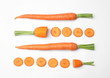 Whole and cut fresh carrots on white background