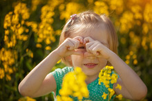 Beautiful Pretty Portrait Little Girl In Yellow Field In Sunny Summer Day