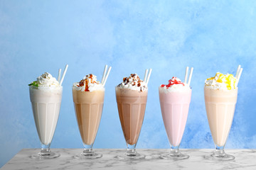 Poster - Glasses with delicious milk shakes on table