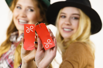 Two woman after sale shopping