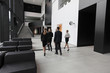© alotofpeople - Business people walking in office lobby