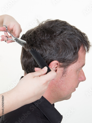 Hairdresser Holding Comb And Scissors In Handsome Man With Black