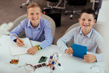 Wall Mural - modern education. happy positive boys smiling while enjoying their lesson