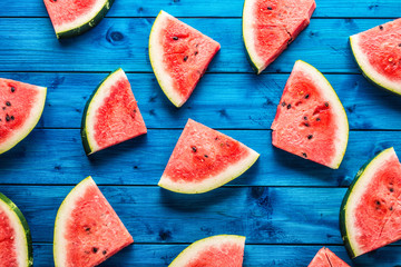 Top of view pieces of fresh watermelon on blue table