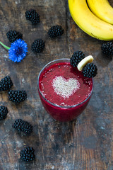 Sticker - Blackberry and banana smoothie garnished with chai seeds - high angle view. Healthy breakfast idea.