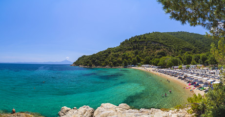 Beautiful panorama with the Mediterranean sea in Greece. crystal and colorful water, rocks, vegetation, beac