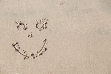 Poster - Handwrited face on the sand at the beach. Symbol Smile on the sand