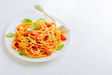 Pasta dish with tomato sauce on white plate