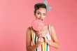 © Drobot Dean - Happy young pin up woman holding candy lollipop.