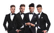 © Viorel Sima - four young men in black tuxedoes standing together
