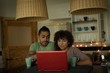 © Wavebreak Media - Couple using laptop while having coffee