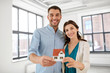 © Syda Productions - mortgage, people and real estate concept - happy couple with house model at empty room of new home